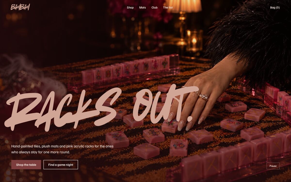 After Hours homepage on desktop: Racks out in brush script over an evening mahjong table