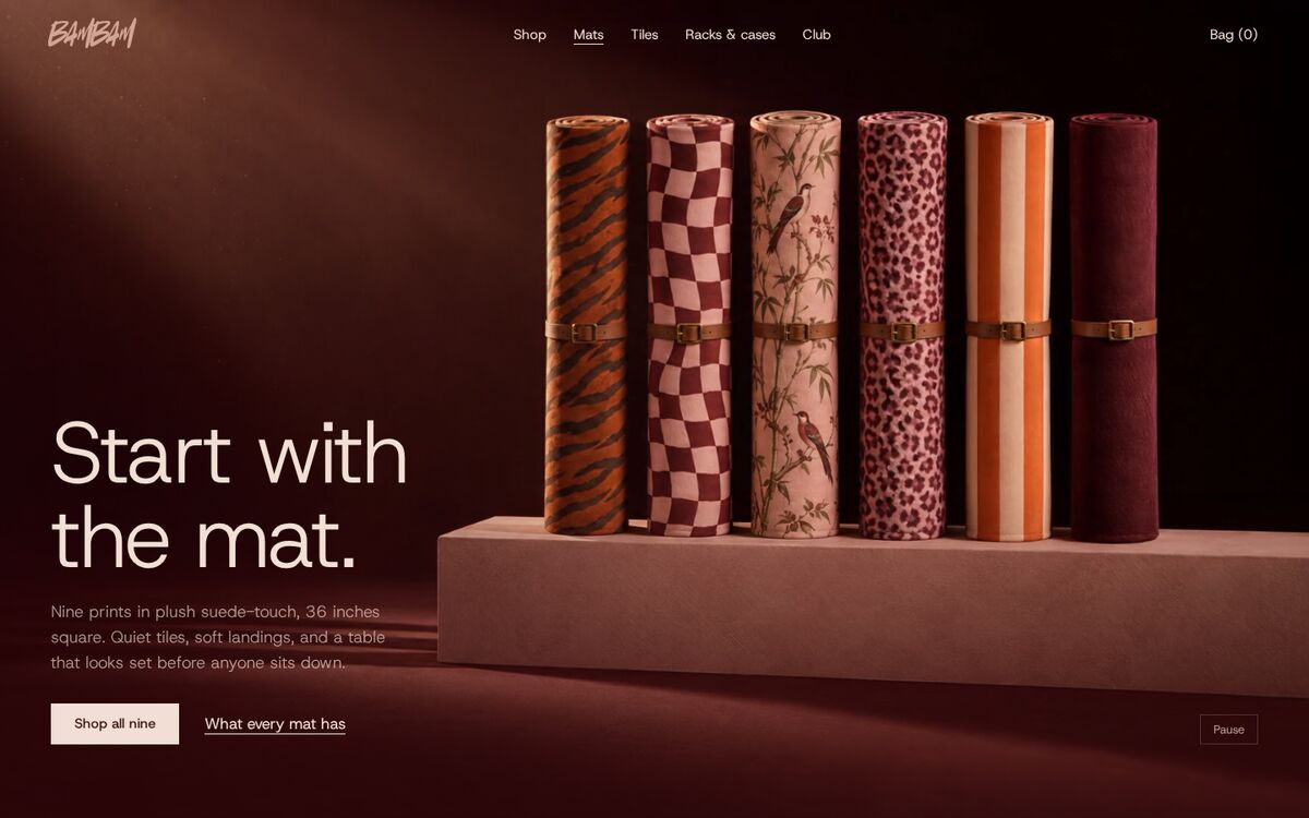 Mats page on desktop: six rolled mats in different prints standing on a plinth